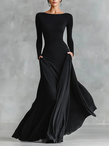 Modern long black crepe dress with pleated boat neckline